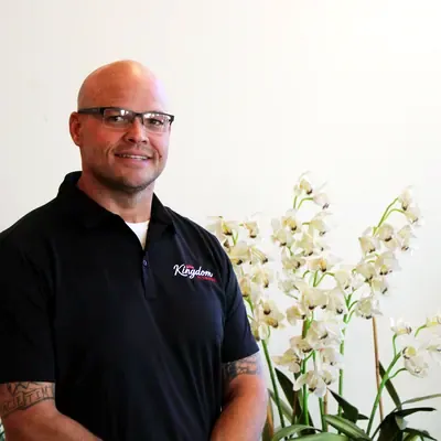 Kingdom Plumbing team member in glasses and a black polo, Las Vegas